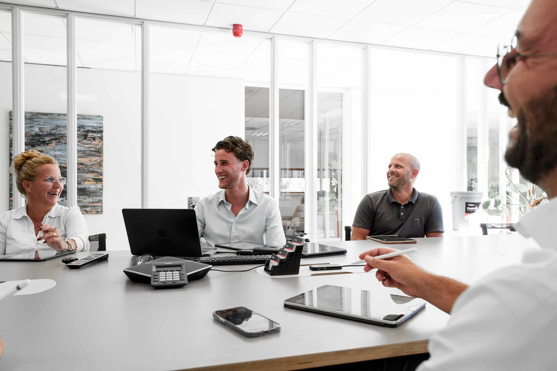 Professionals in a casual meeting in a modern office